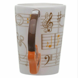 Guitar Mug With Guitar Shaped Handle and  With A  Sheet Music Design